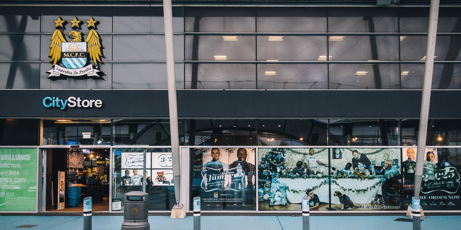 The photography up on display on the shop front of the City Store in Manchester