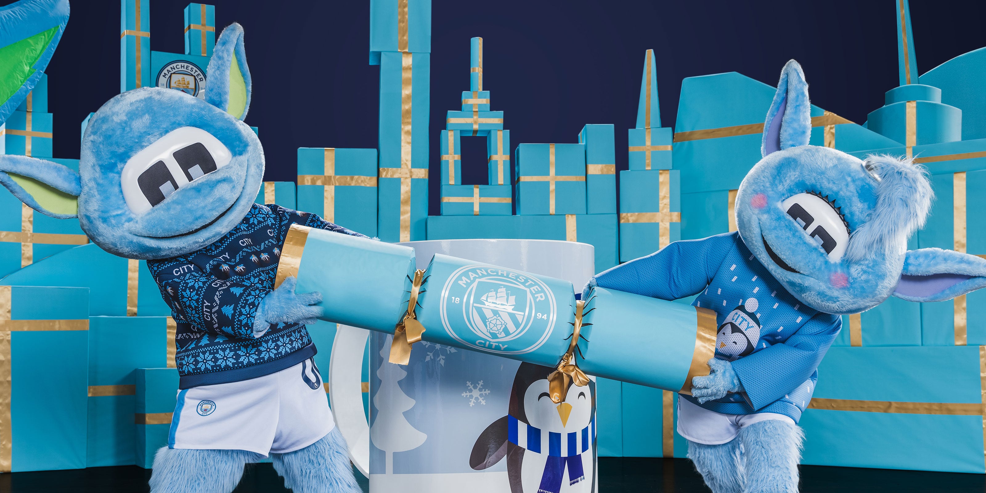 Moonbeam & Moonchester pulling a cracker for the Big City Christmas brand campaign