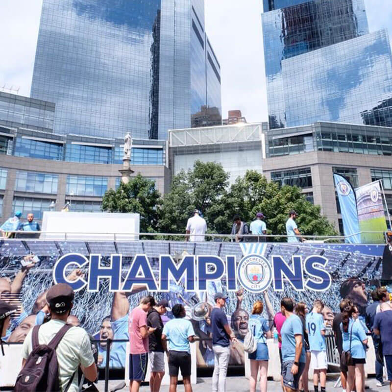 Incidental taken from the cities on tour - fans gathering around 'Champions' campaign artwork