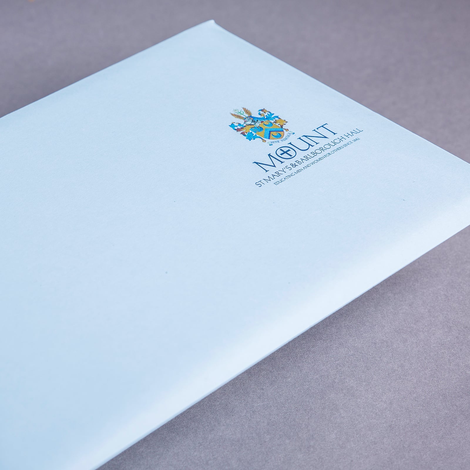 As the brochure would also be used as a direct mail piece, a bespoke branded envelope was designed