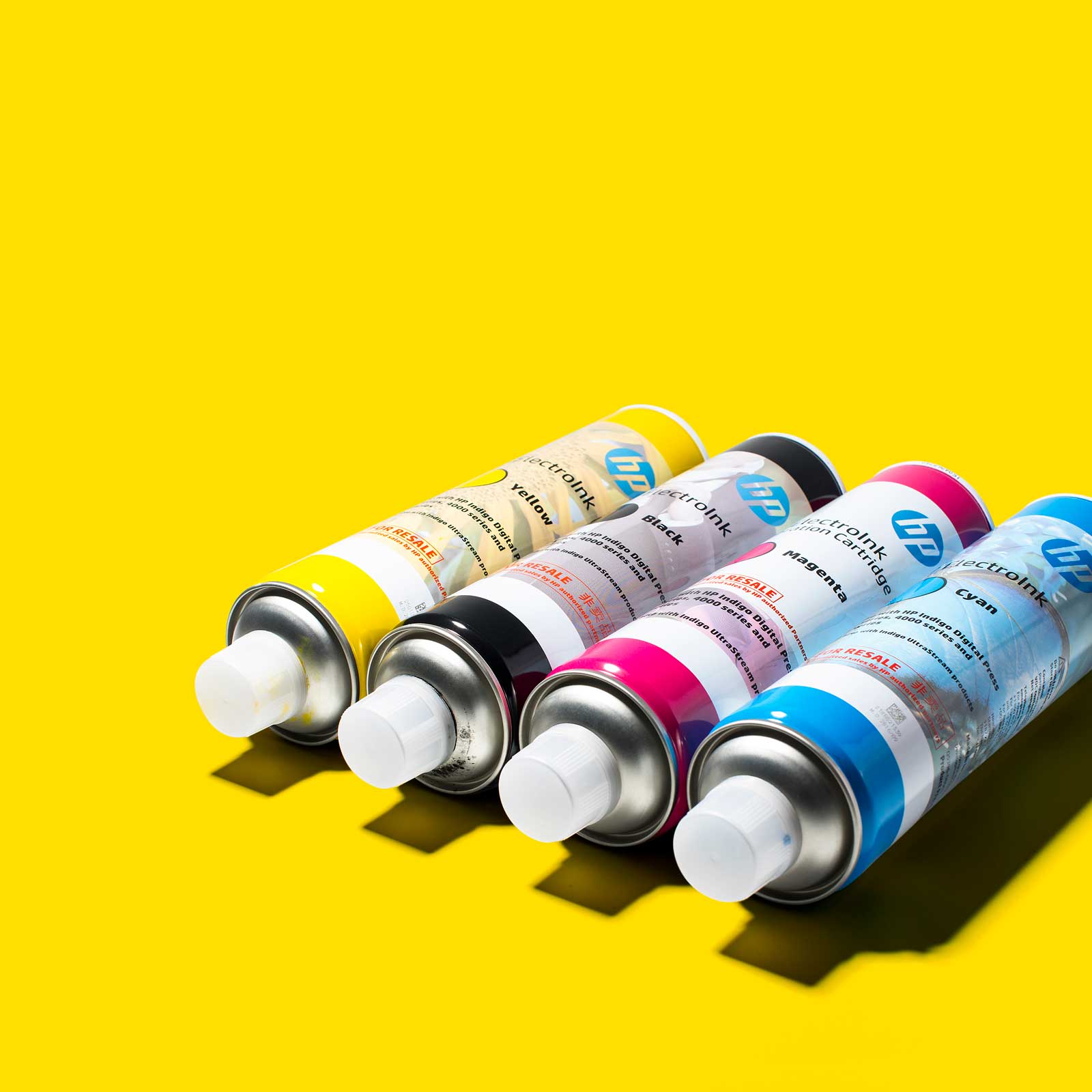 This shot of spray cans shows the bold product photography designed around colour