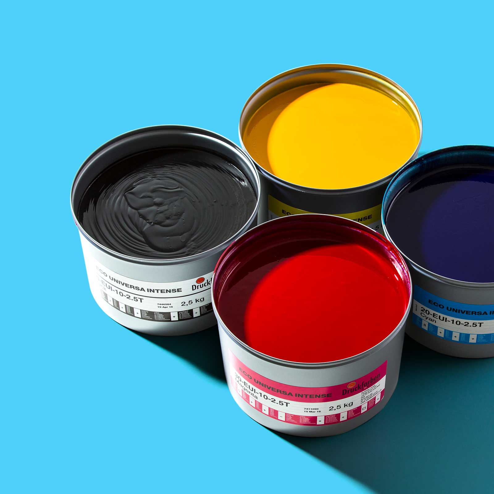 A set of colourful product shots, like these ink cans, were collected in a photoshoot at our photography studios