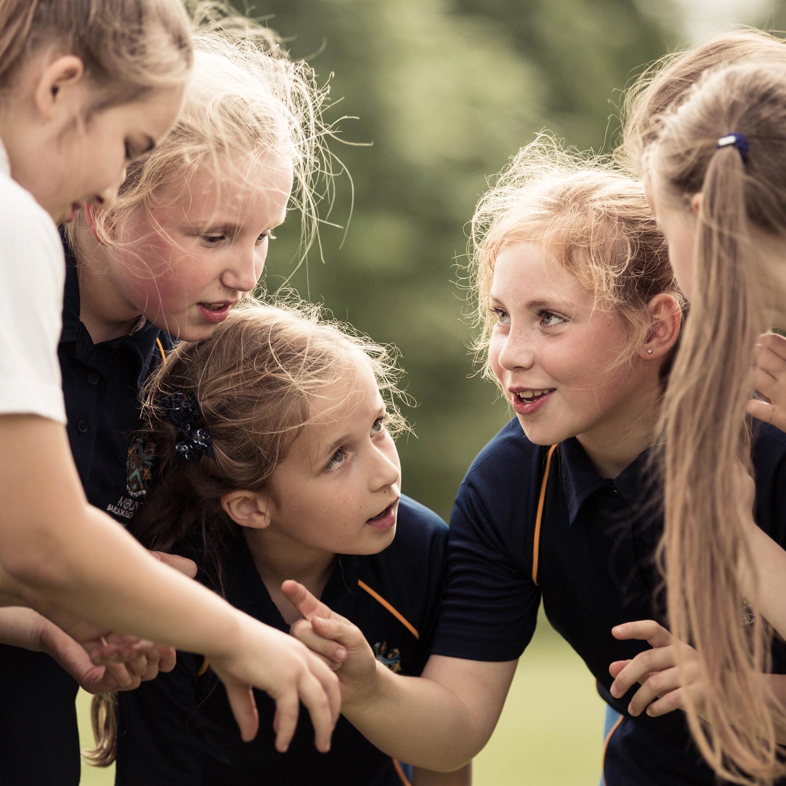 Group of school girls playing sports at school
