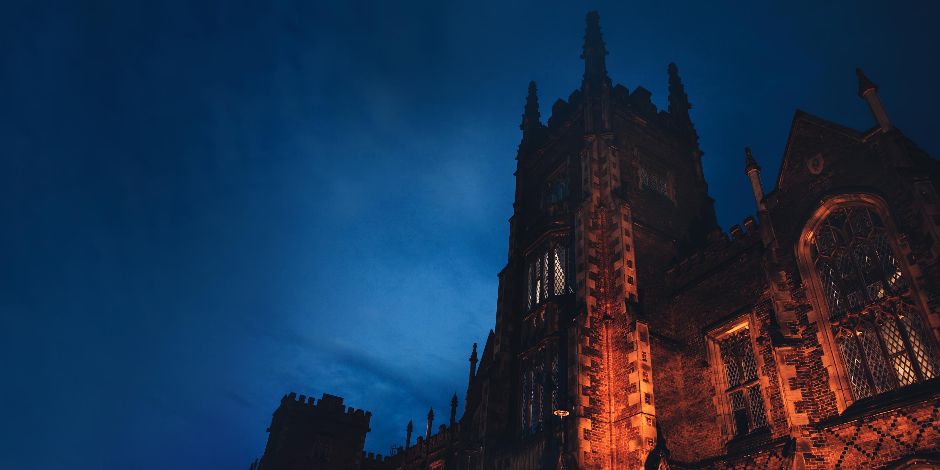 Queens University Belfast campus at night