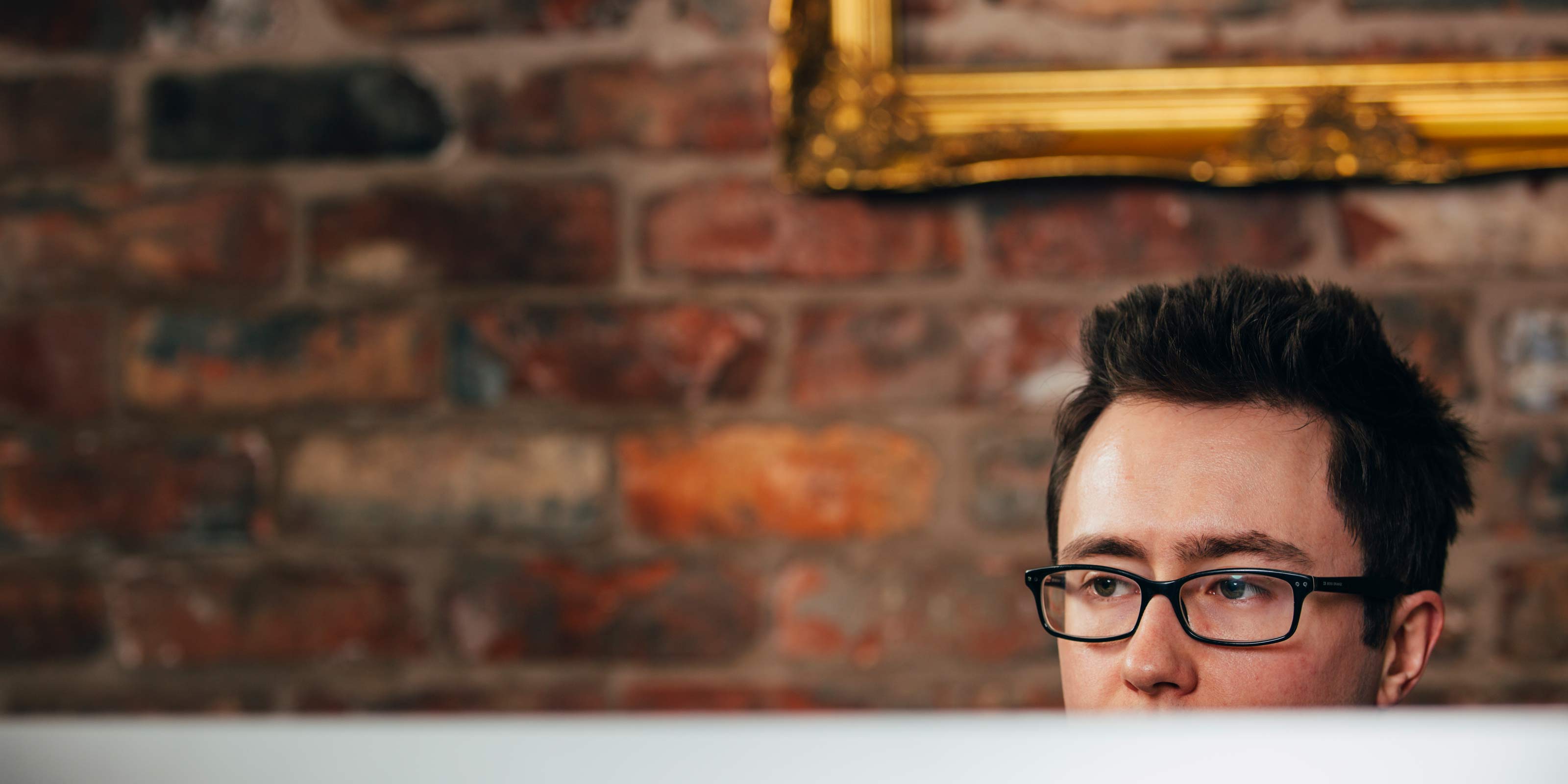 Web developer sat at his computer