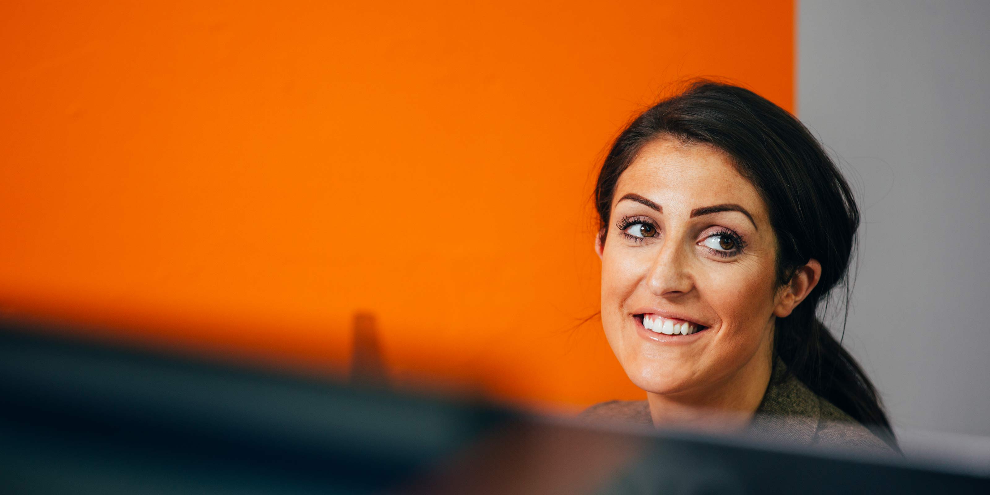 Female shield employee in office