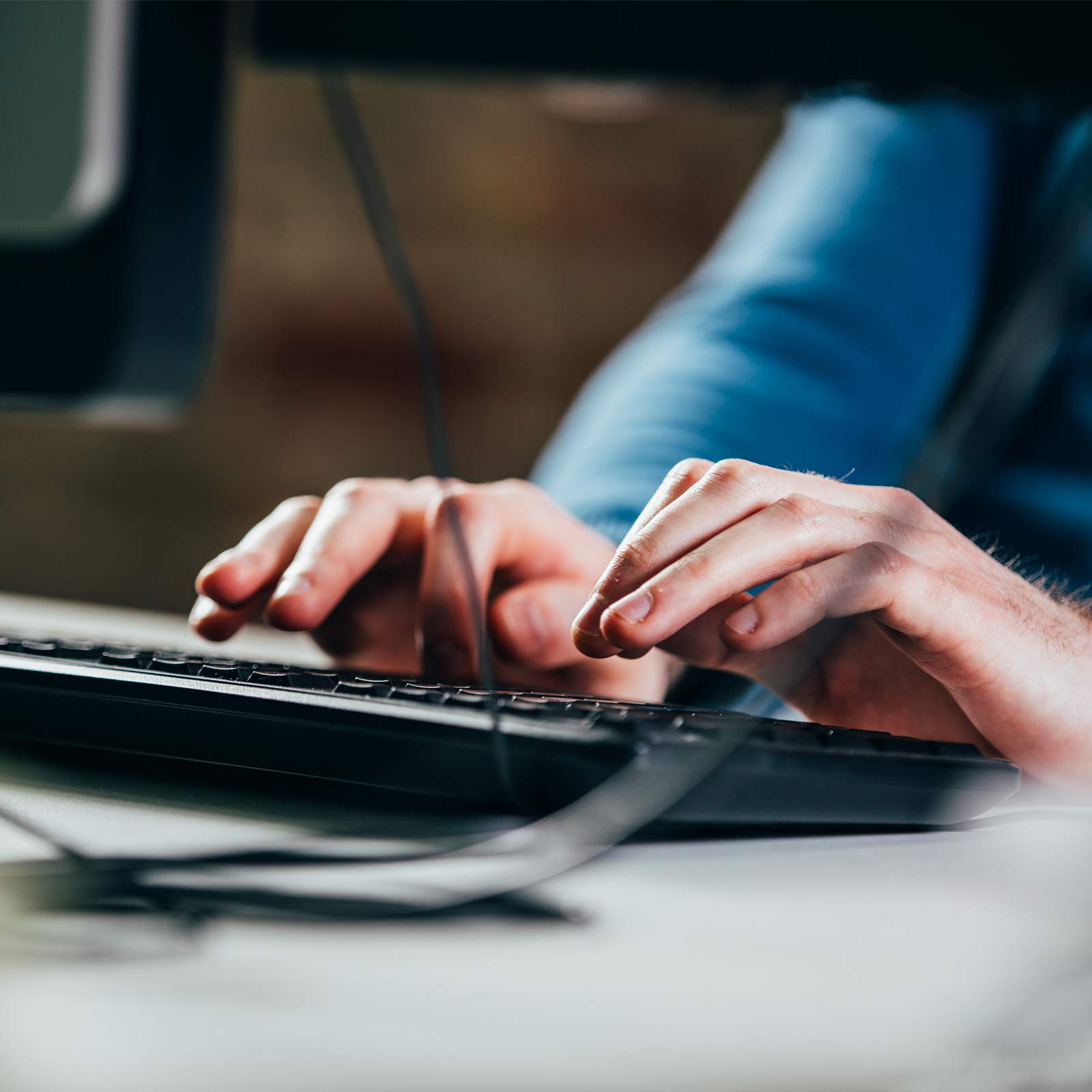 Web developer close up hands typing