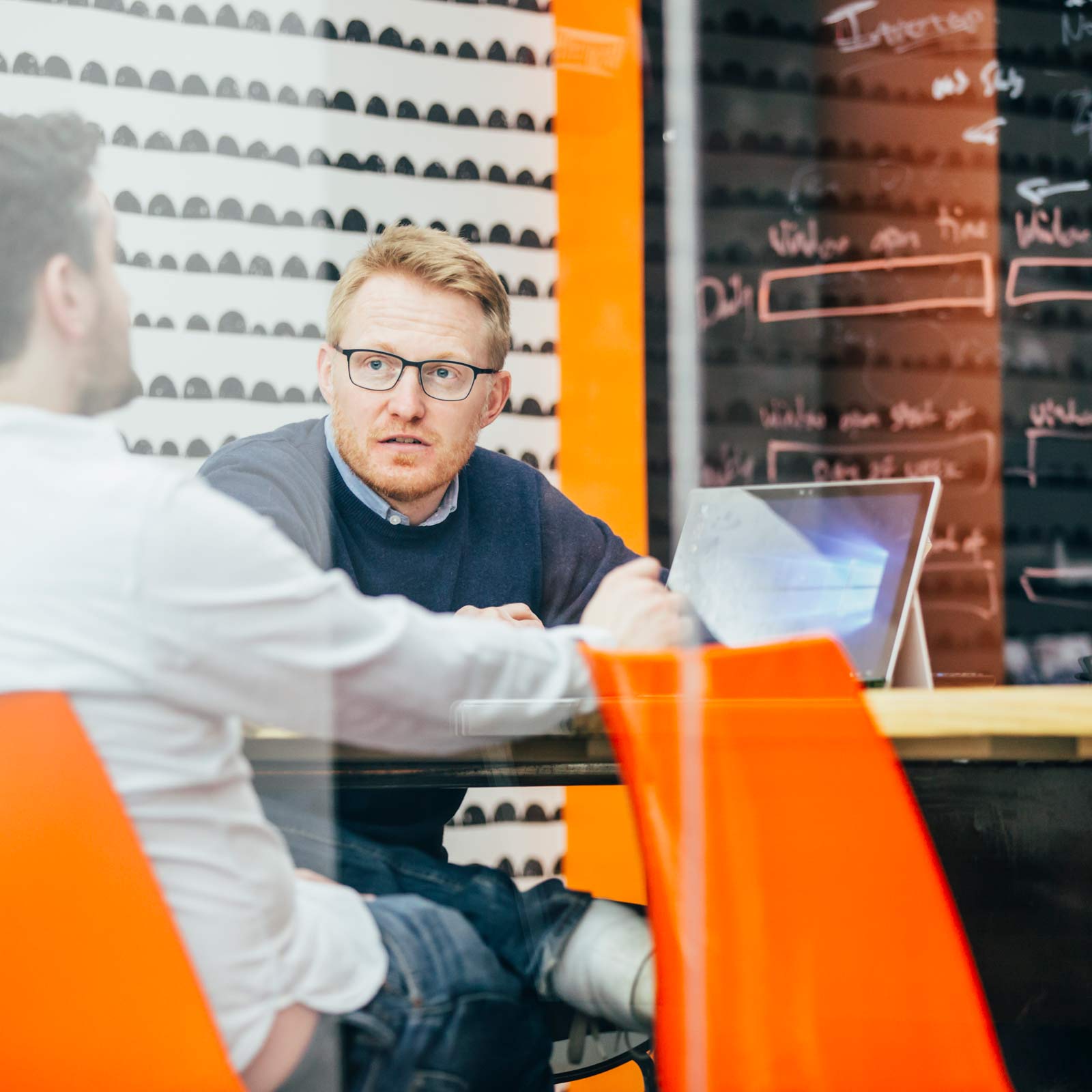 Male Shield employees in a meeting room