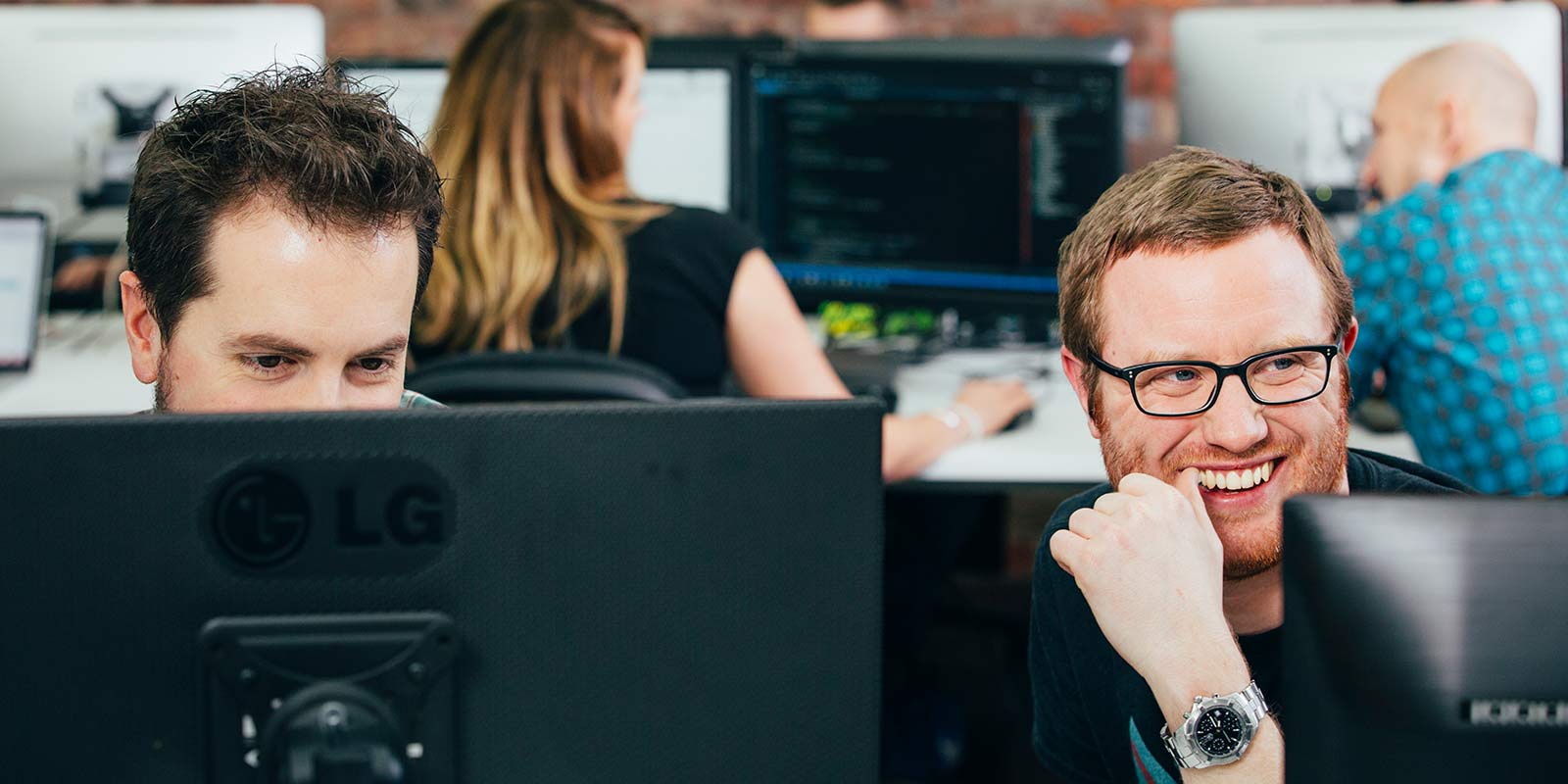Male Shield employees in the office